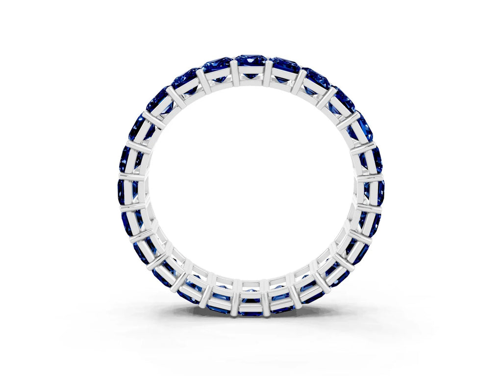 Emerald Cut Blue Sapphire Eternity Band in White gold with Aligned Shared Prong Setting 