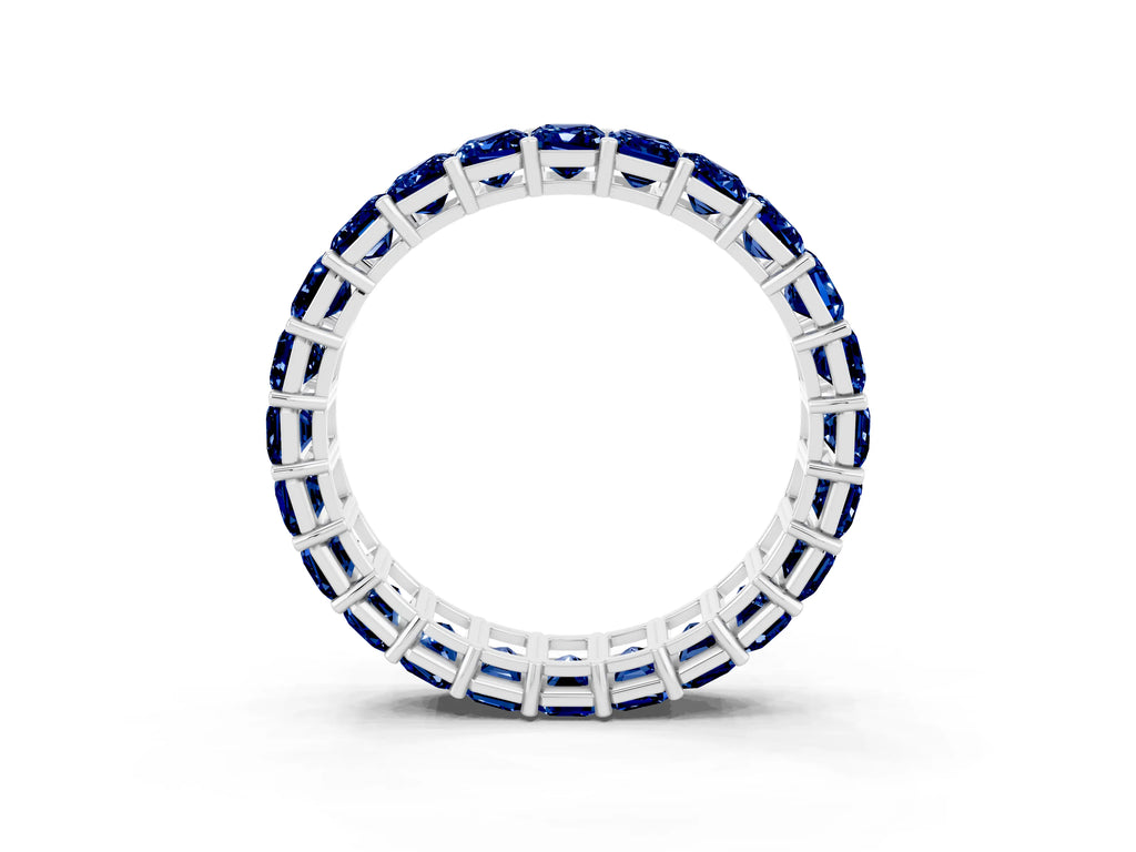 Emerald Cut Blue Sapphire Eternity Band in White gold with Aligned Shared Prong Setting