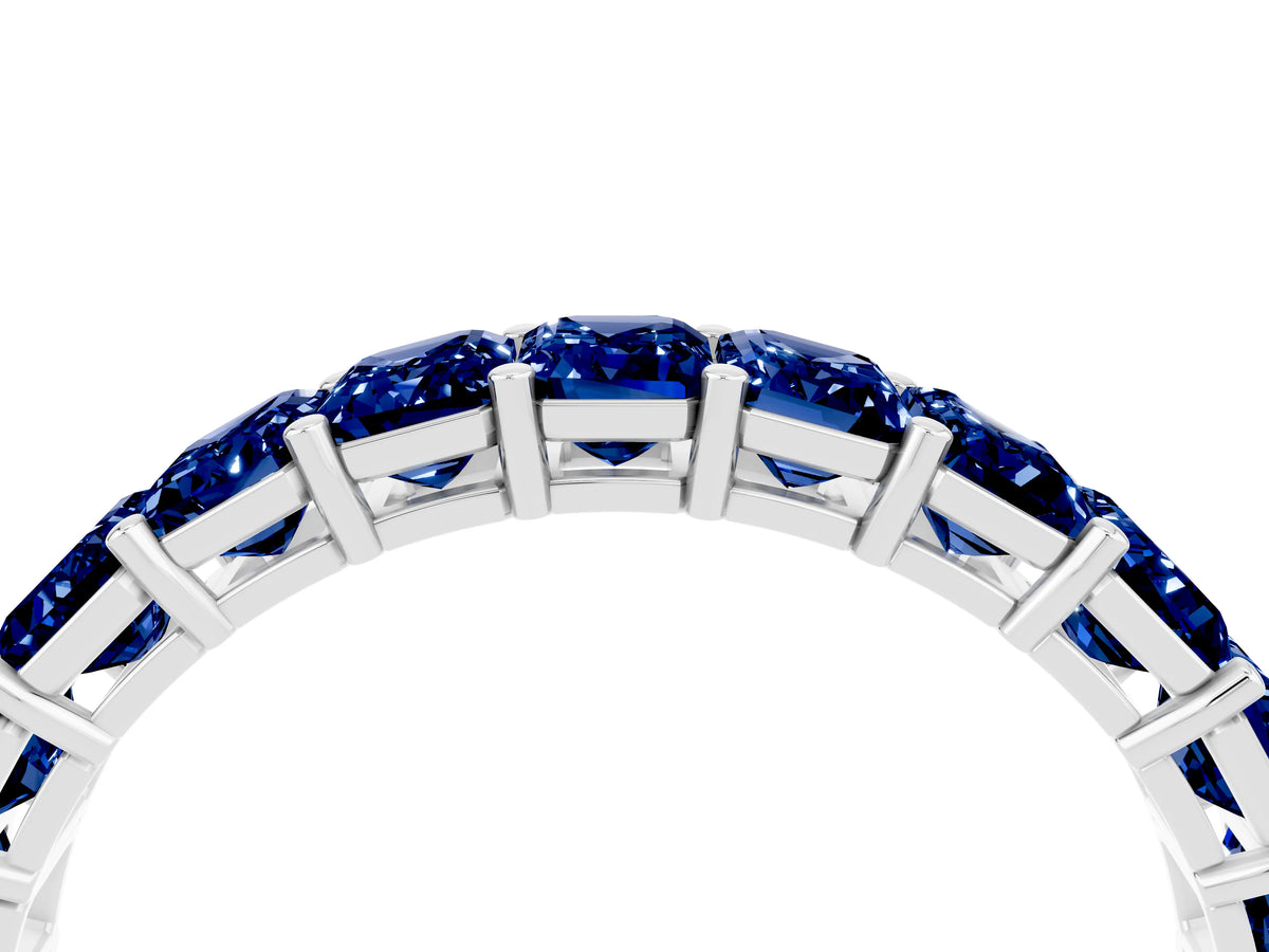 Emerald Cut Blue Sapphire Eternity Band in White gold with Aligned Shared Prong Setting