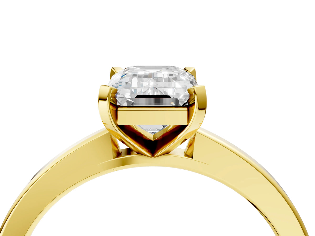Emerald Cut Diamond Solitaire Engagement Ring in Yellow gold with Prong Setting