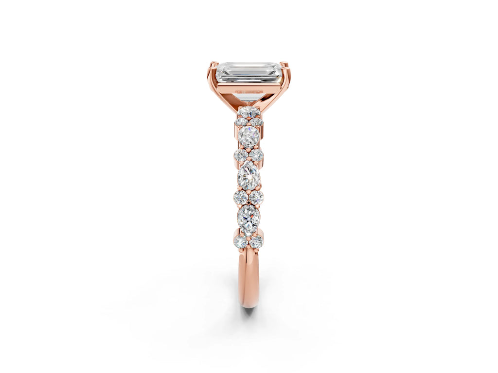 Emerald Cut Diamond Solitaire Ring in Rose gold with Pear and Round Cluster Band