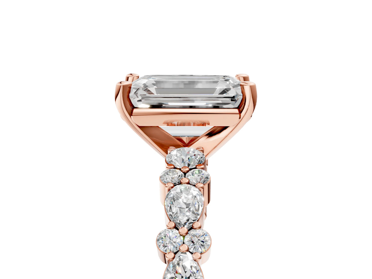 Emerald Cut Diamond Solitaire Ring in Rose gold with Pear and Round Cluster Band
