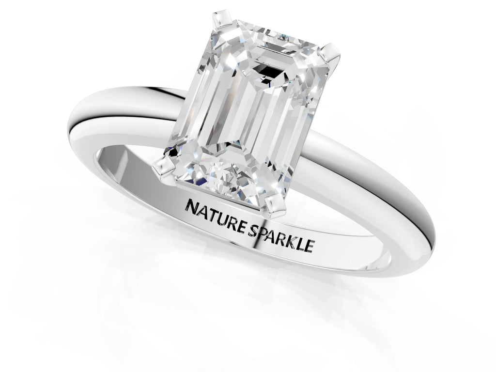 Emerald Cut Diamond Solitaire Ring in White gold with Prong Setting and Rounded Band