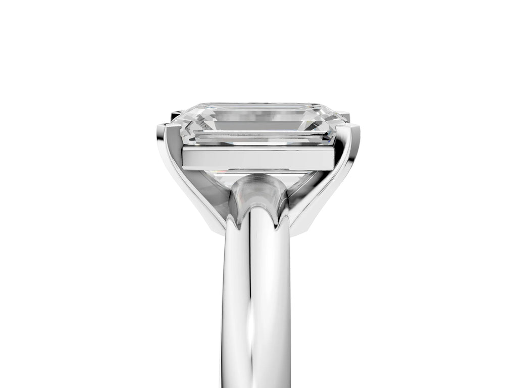 Emerald Cut Diamond Solitaire Ring in Silver with Prong Setting and Rounded Band