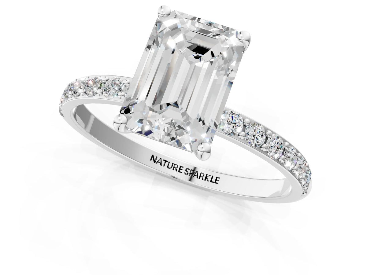 Emerald Cut Diamond Solitaire Ring in Silver with Round Pavé Band