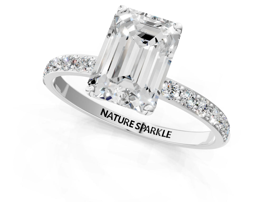 Emerald Cut Diamond Solitaire Ring in White gold with Round Shared Prong Pavé Band
