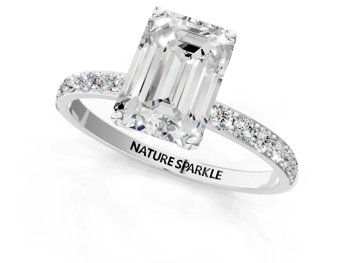 Emerald Cut Diamond Solitaire Ring in Silver with Round Shared Prong Pavé Band