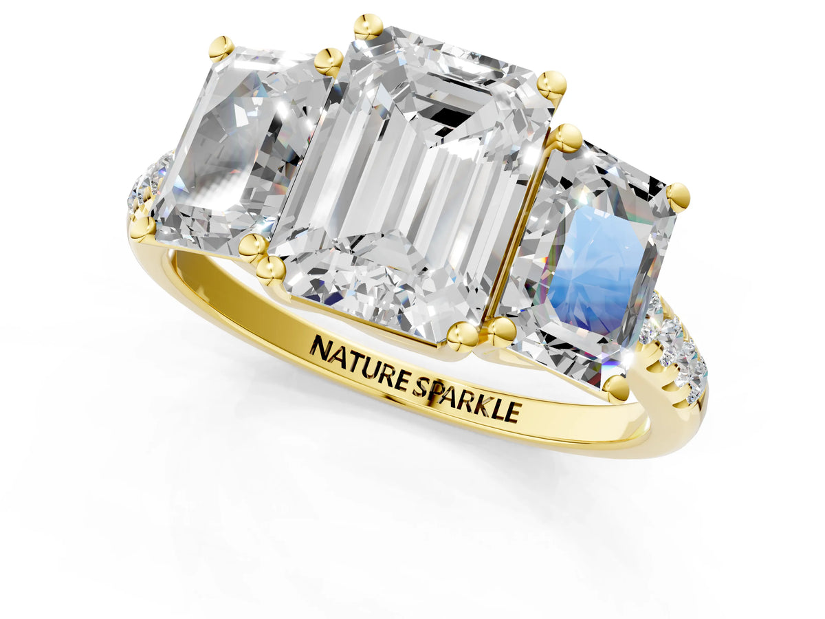 Emerald Cut Diamond Trellis Three-Stone Engagement Ring in Yellow gold with Round Side Stones