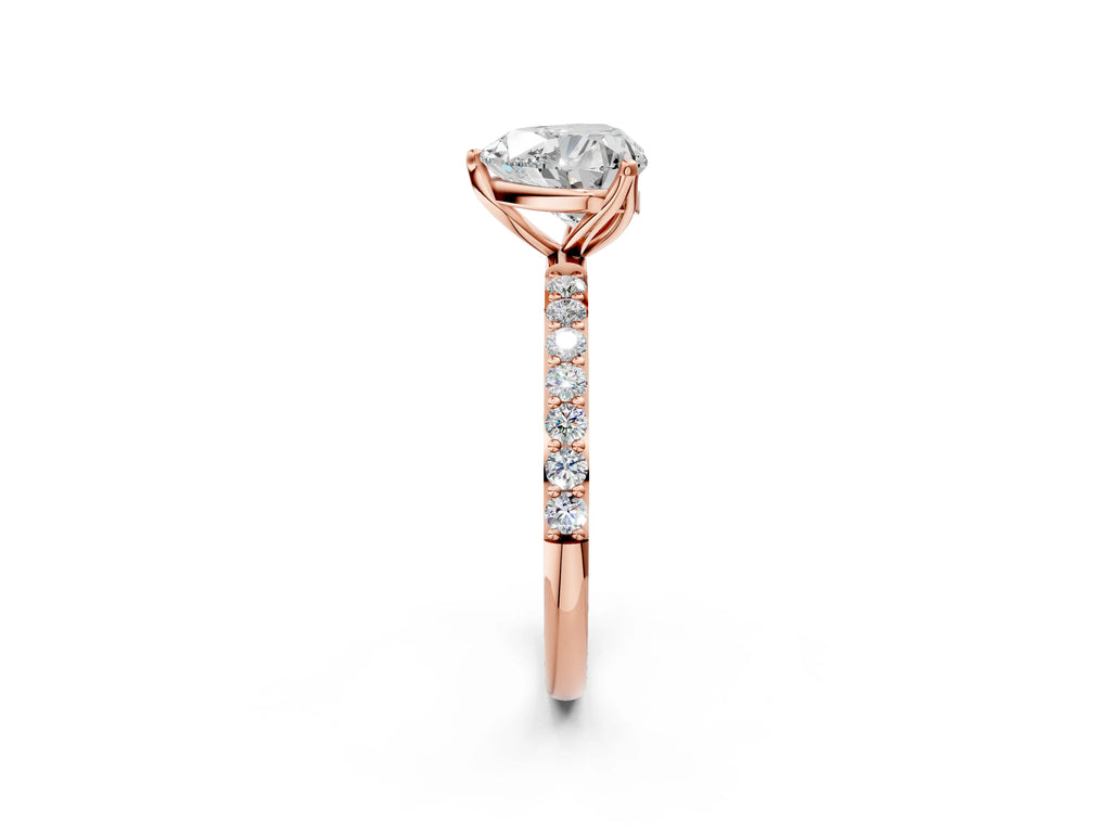 Heart Cut Diamond Solitaire Ring in Rose gold with Round Shared Prong Pavé Band