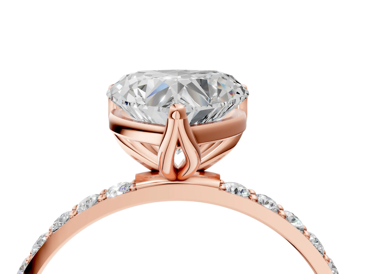 Heart Cut Diamond Solitaire Ring in Rose gold with Round Shared Prong Pavé Band