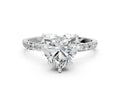 Heart Cut Diamond Solitaire Ring in Platinum with Round Pavé Band