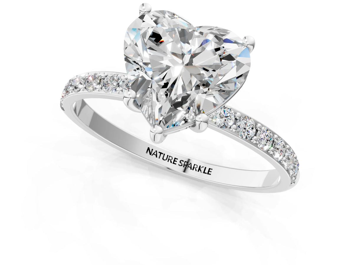 Heart Cut Diamond Solitaire Ring in Platinum with Round Pavé Band