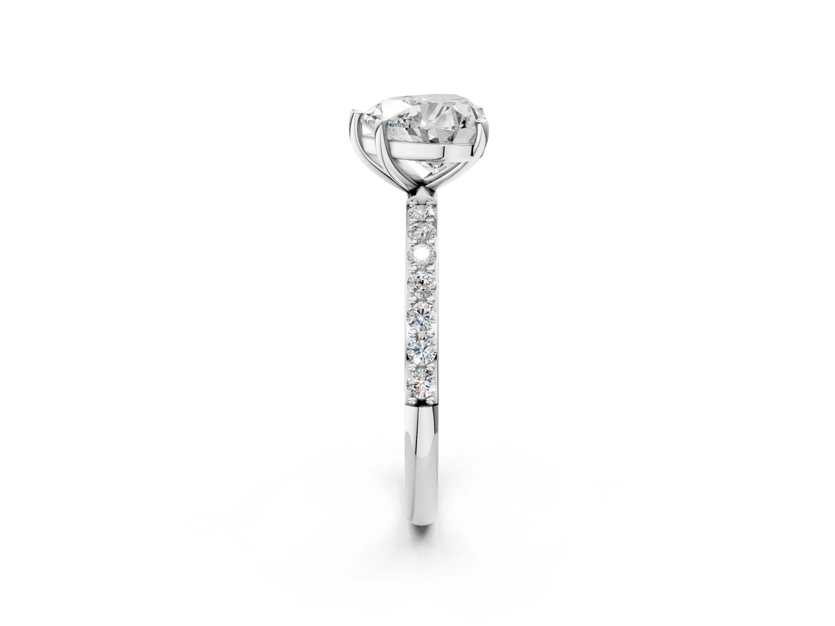 Heart Cut Diamond Solitaire Ring in Platinum with Round Pavé Band