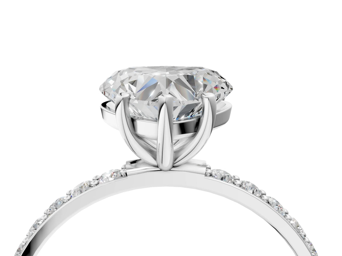Heart Cut Diamond Solitaire Ring in Platinum with Round Pavé Band