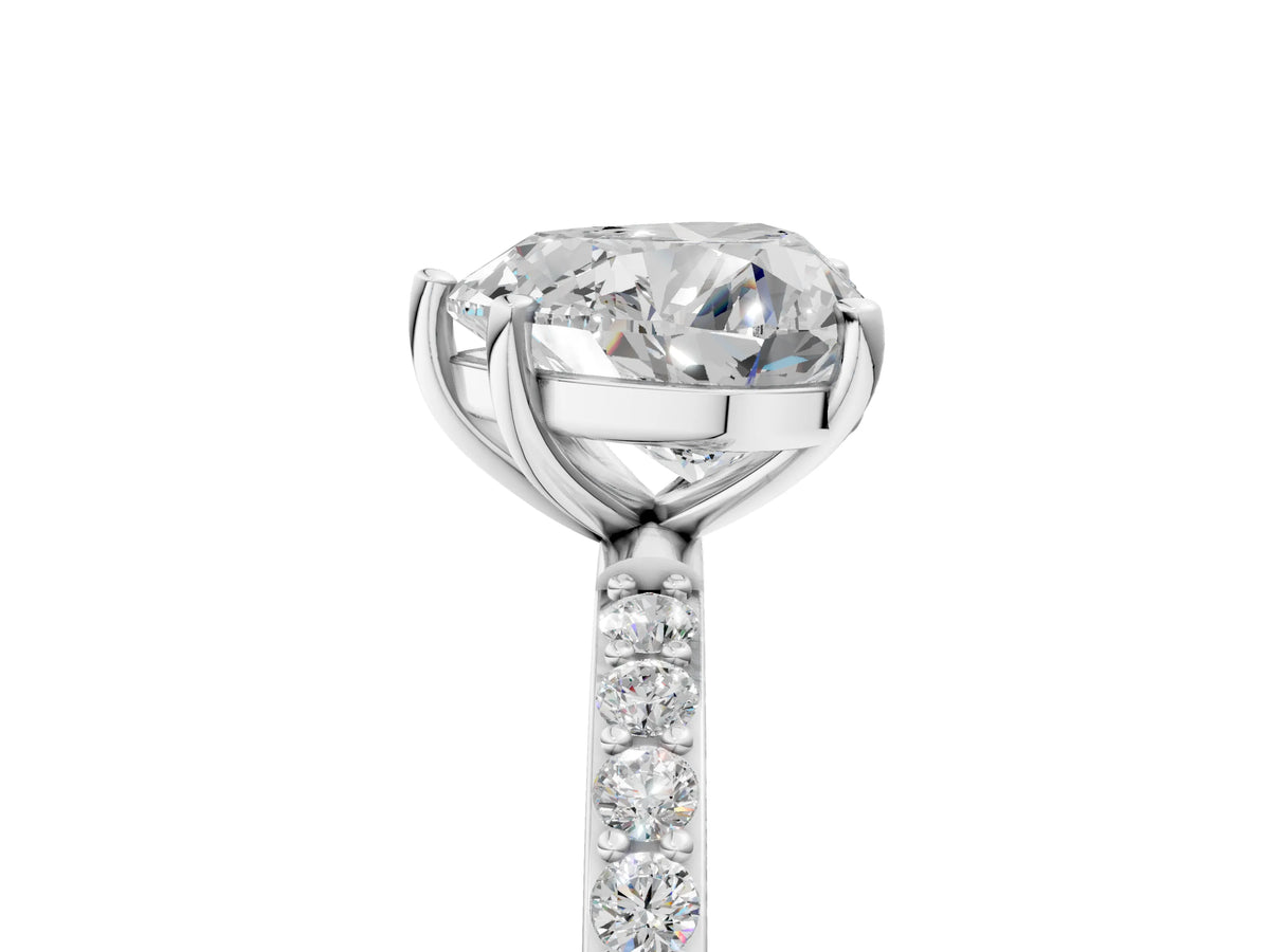 Heart Cut Diamond Solitaire Ring in Platinum with Round Pavé Band