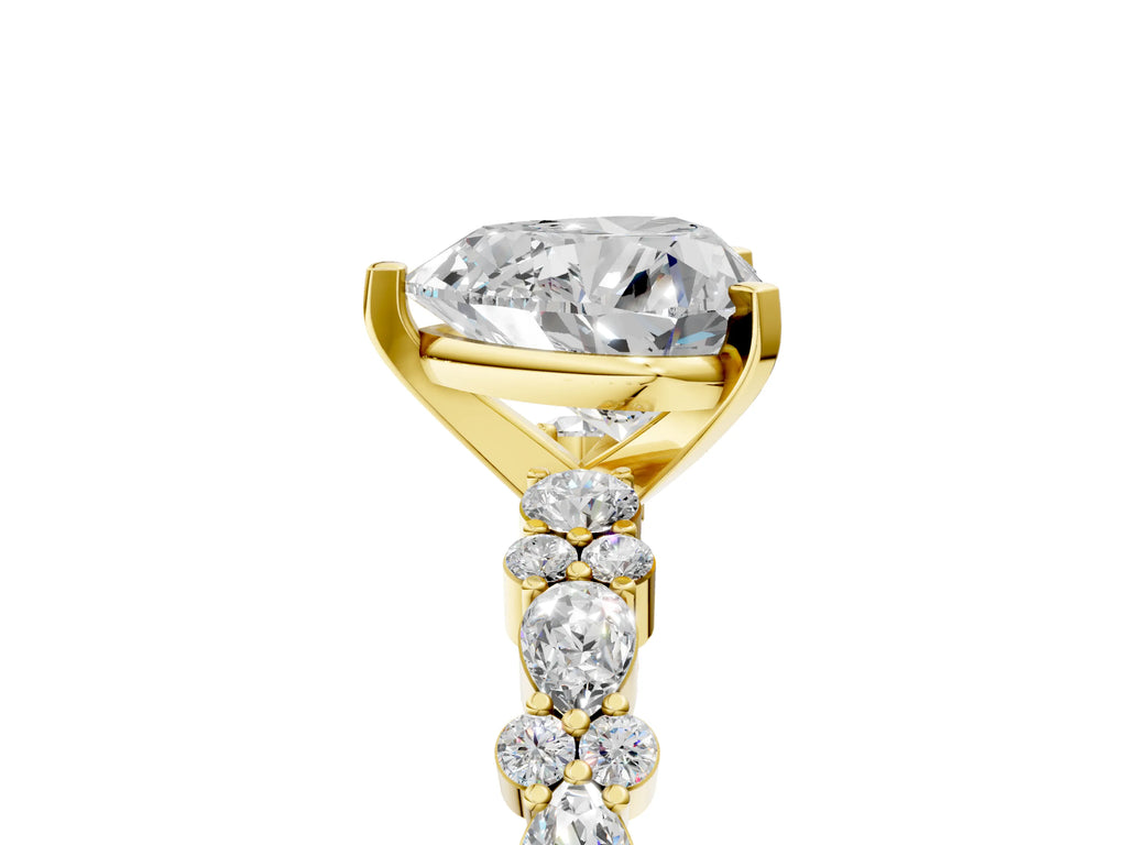 Heart Cut Diamond Solitaire Ring in Yellow gold with Pear and Round Cluster Band