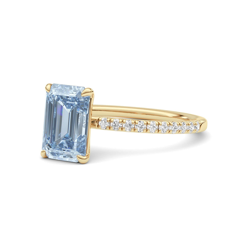 Yellow gold Fancy Blue Emerald Cut Diamond Solitaire with Pavé Band