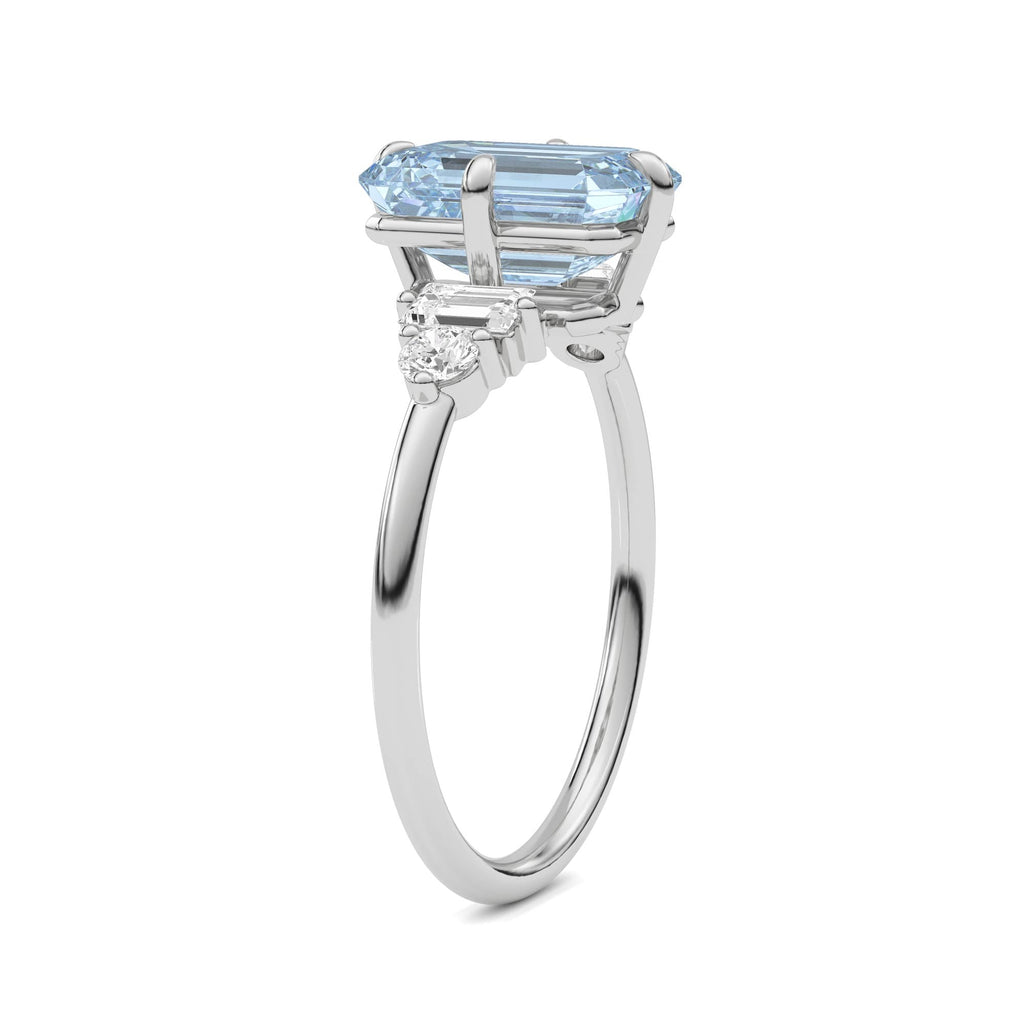 Silver Three-Stone Fancy Blue Emerald Cut Diamond Ring with Heart Side Stones