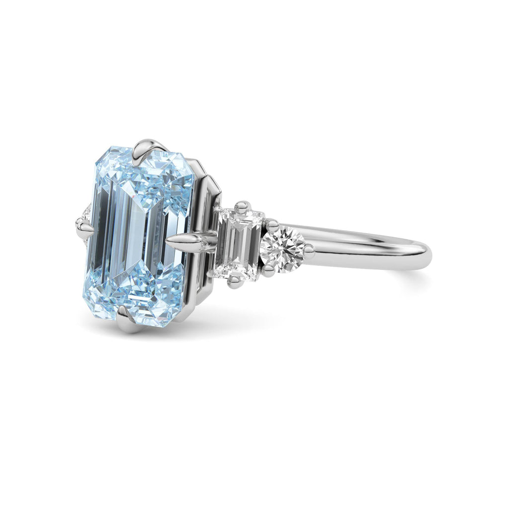 Silver Three-Stone Fancy Blue Emerald Cut Diamond Ring with Heart Side Stones