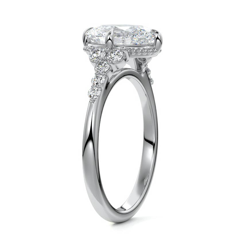 Platinum Oval Diamond Side Stone Engagement Ring with Cluster Accents