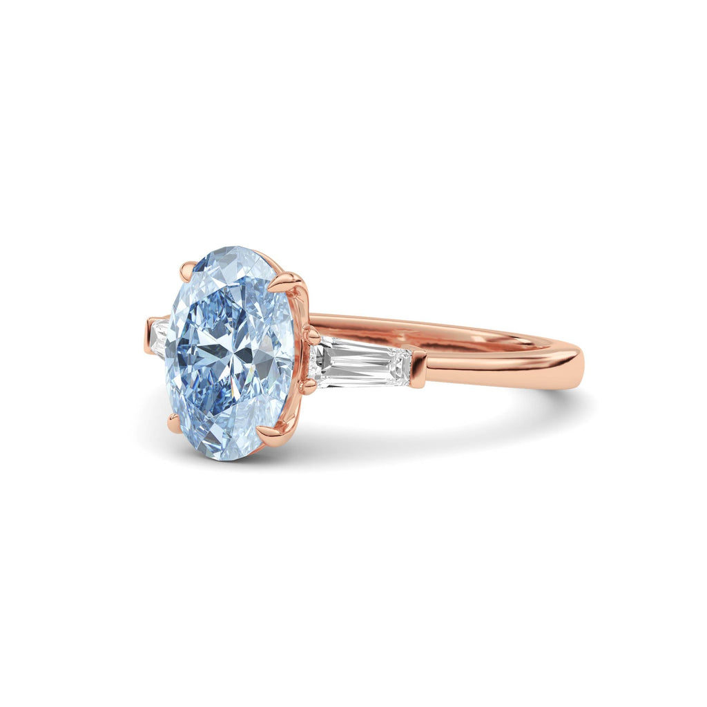 Rose gold Three-Stone Fancy Blue Oval Cut Diamond Ring with Tapered Baguette Side Stones