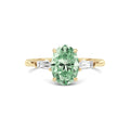 Yellow gold Three-Stone Fancy Green Oval Cut Diamond Ring with Tapered Baguette Side Stones
