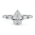 Silver Three-Stone Pear Diamond Ring with Tapered Baguette Side Stones