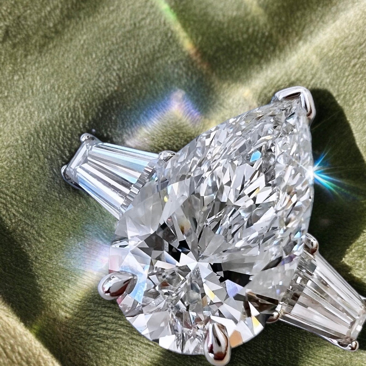 Silver Three-Stone Pear Diamond Ring with Tapered Baguette Side Stones