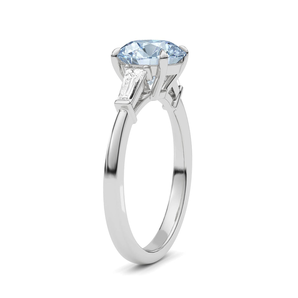 Platinum Three-Stone Fancy Blue Round Cut Diamond Ring with Tapered Baguette Side Stones