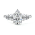 White gold Pear Diamond Side Stone Engagement Ring with Round Floral Cluster Accents
