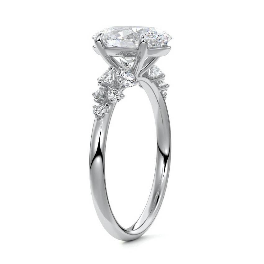 Platinum Oval Diamond Side Stone Engagement Ring with Round Floral Cluster Accents