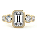 Yellow gold Emerald Diamond Ring with Bezel Setting and Round Side Accents