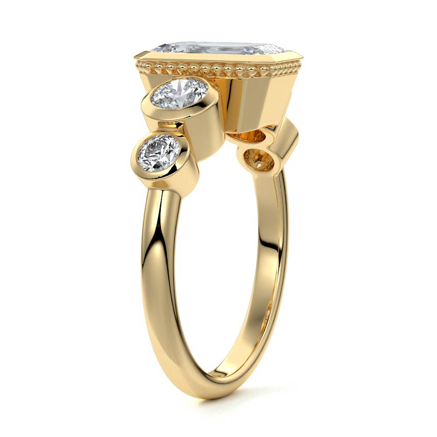 Yellow gold Emerald Diamond Ring with Bezel Setting and Round Side Accents