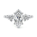 White gold Marquise Diamond Side Stone Engagement Ring with Clustered Round Accents