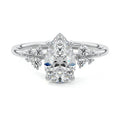 Silver Pear Diamond Side Stone Engagement Ring with Clustered Round Accents