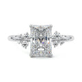 Platinum Radiant Diamond Side Stone Engagement Ring with Clustered Round Accents