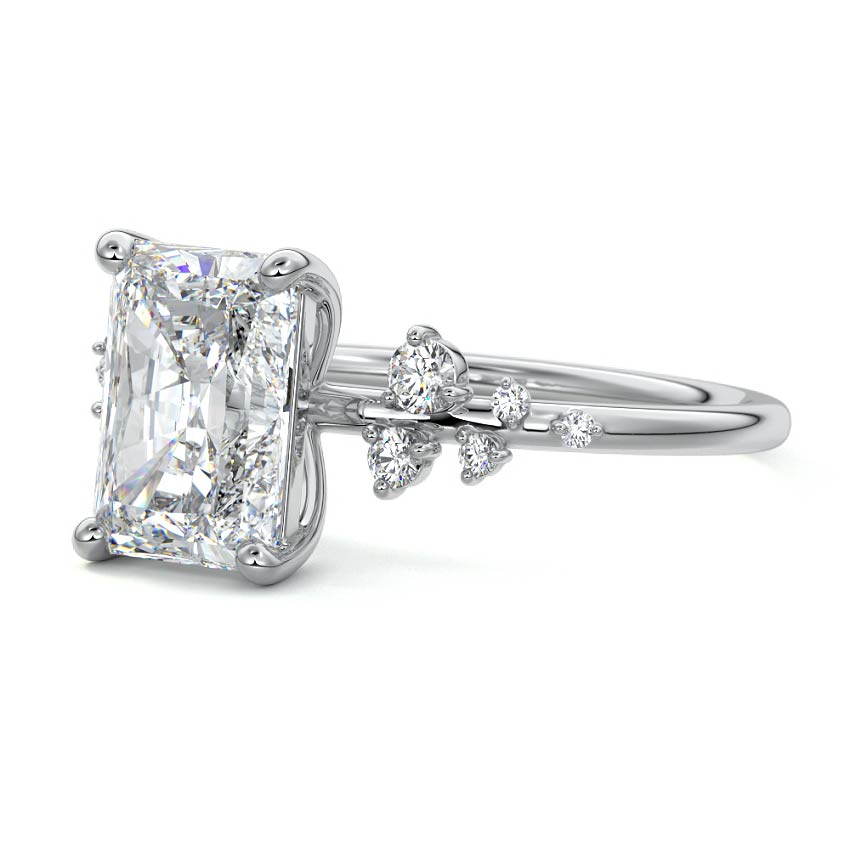 Platinum Radiant Diamond Side Stone Engagement Ring with Clustered Round Accents
