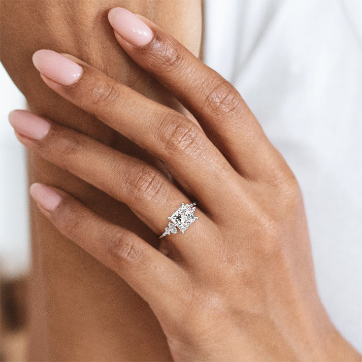 Platinum Princess Diamond Side Stone Engagement Ring with Clustered Round Accents