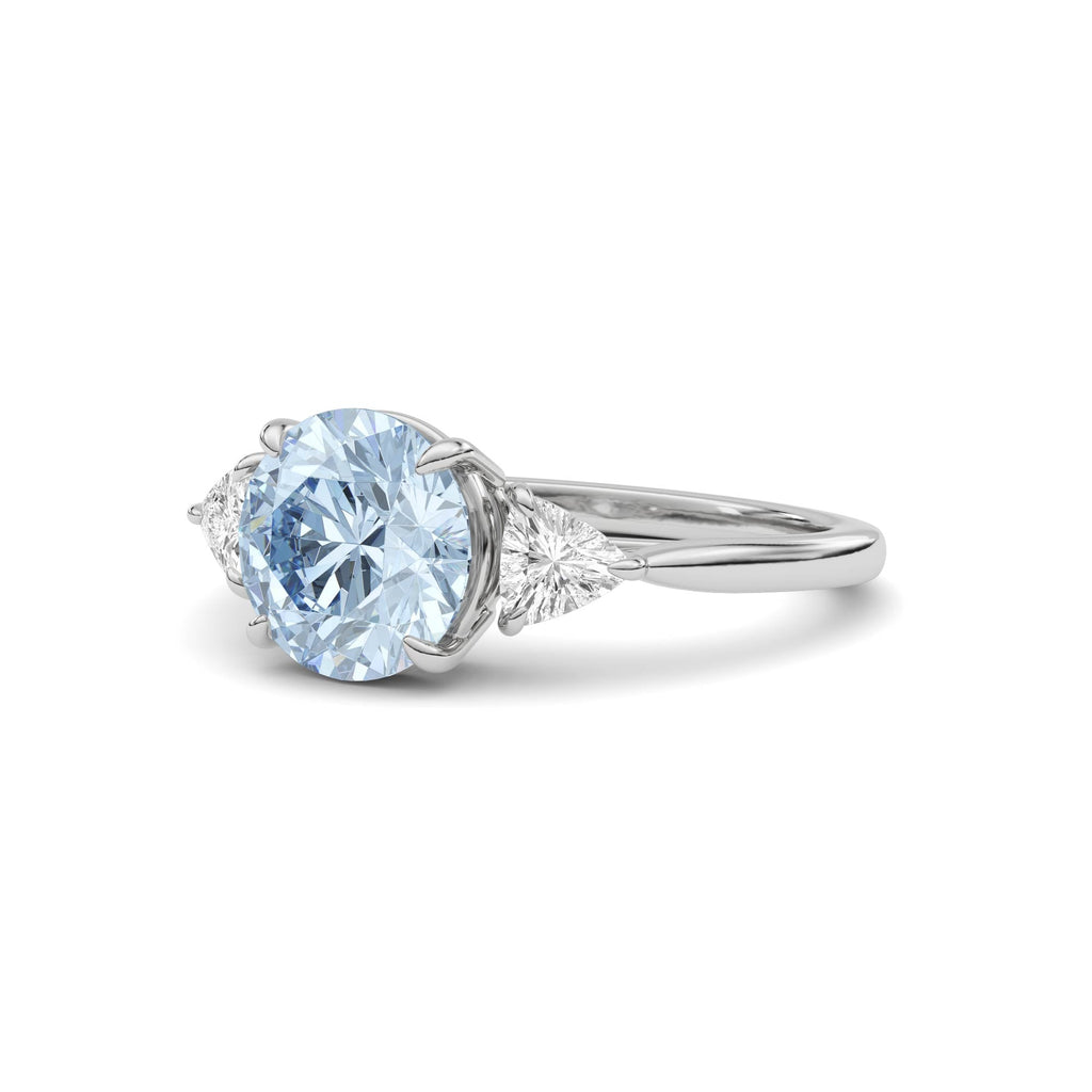 White gold Three-Stone Fancy Blue Round Cut Diamond Ring with Trillion Side Stones