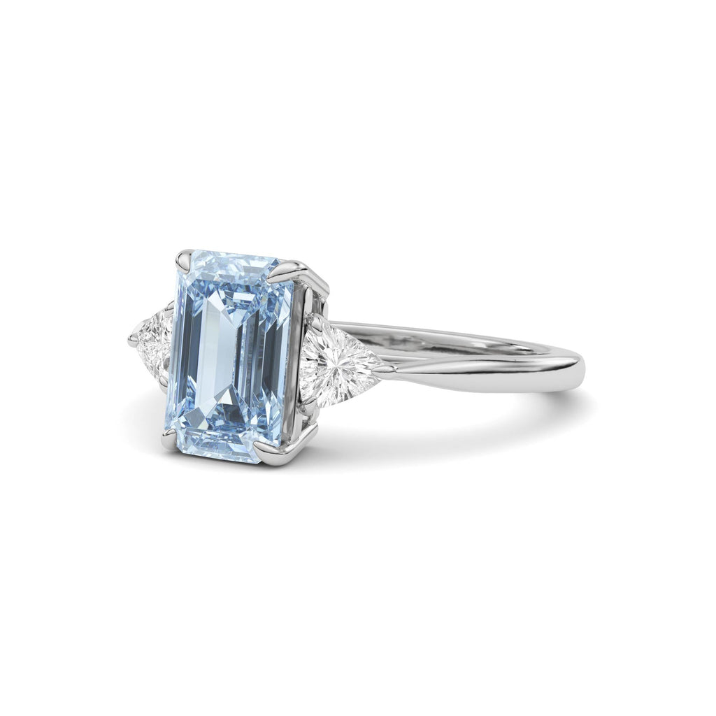 Platinum Three-Stone Fancy Blue Emerald Cut Diamond Ring with Trillion Side Stones