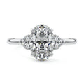 Platinum Oval Diamond Side Stone Engagement Ring