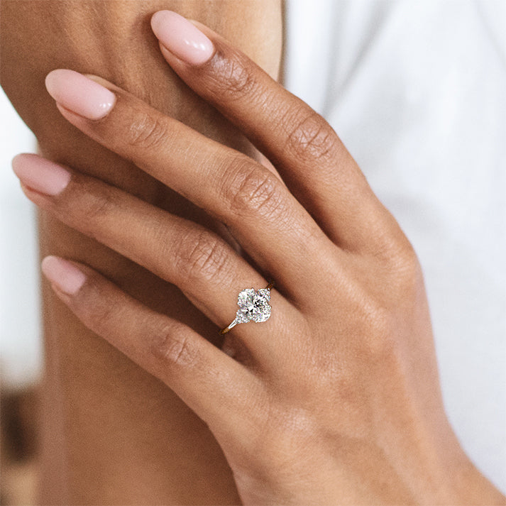 Platinum Oval Diamond Side Stone Engagement Ring
