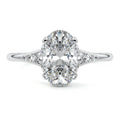 White gold Oval Diamond Engagement Ring with Side Stone Accents and Prong Setting