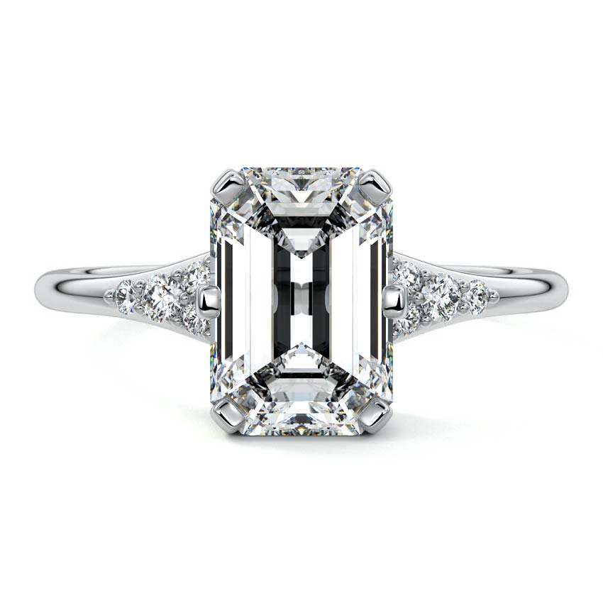 Platinum Emerald Diamond Engagement Ring with Side Stone Accents and Prong Setting
