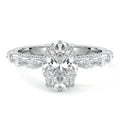Platinum Oval Diamond Engagement Ring with Marquise Side Stones and Prong Setting