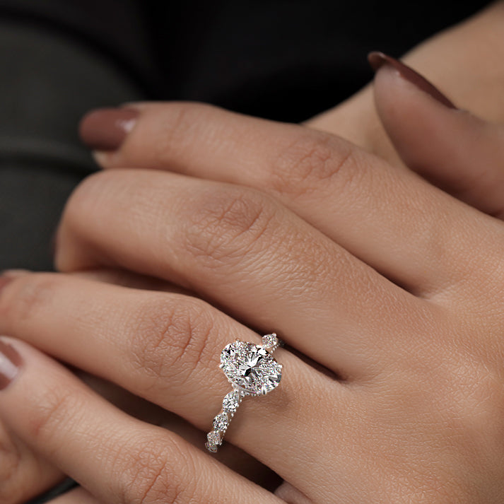 Platinum Oval Diamond Engagement Ring with Marquise Side Stones and Prong Setting