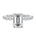 Silver Emerald Diamond Engagement Ring with Round Side Stones and Prong Setting