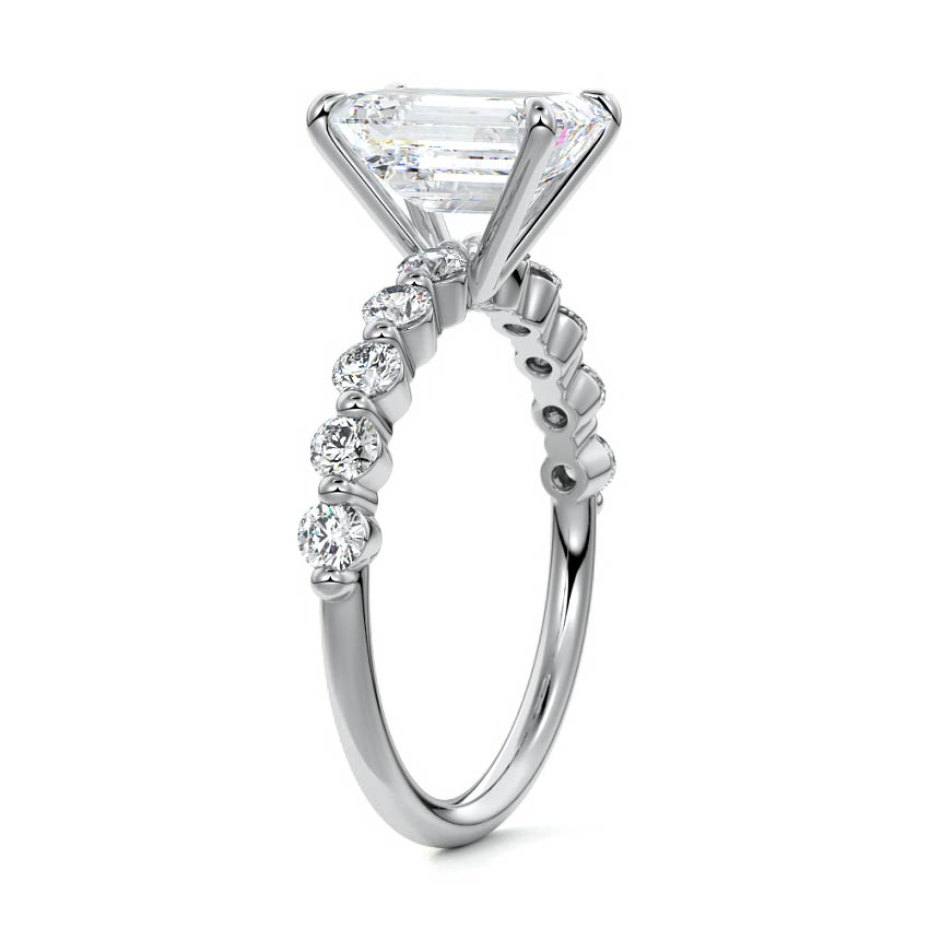 Silver Emerald Diamond Engagement Ring with Round Side Stones and Prong Setting