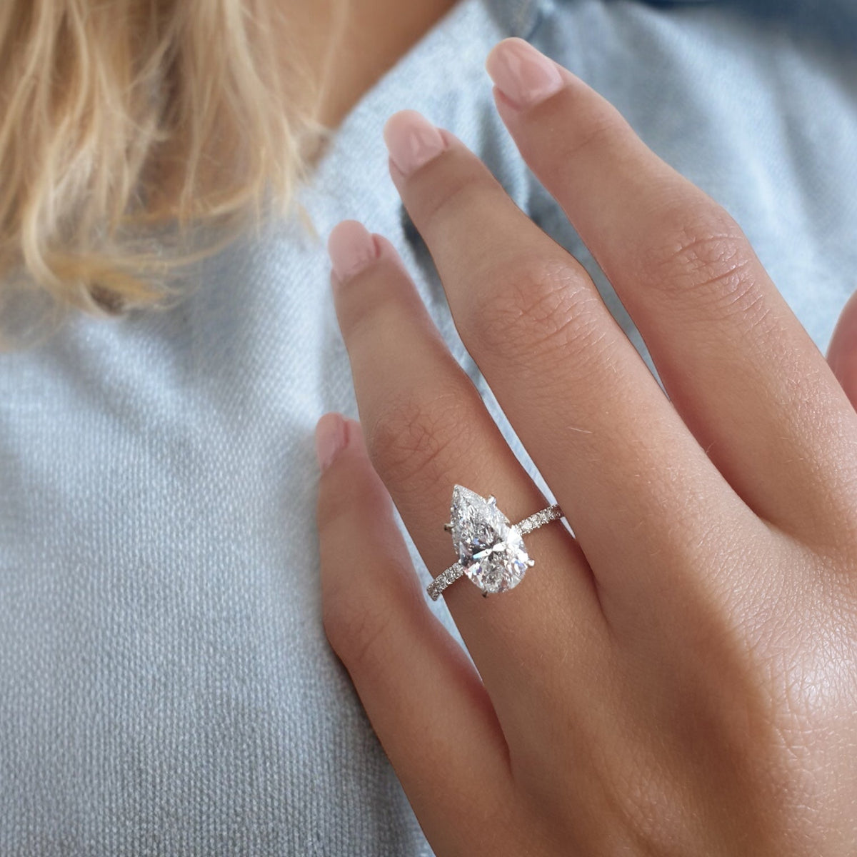 White gold Pear Diamond Ring with Pavé Band and Hidden Halo