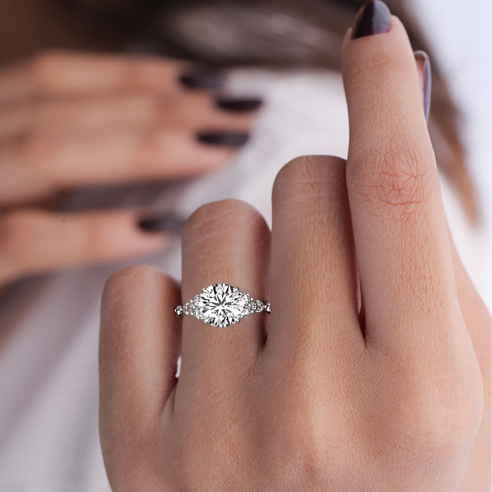 White gold Round Diamond Engagement Ring with Mixed Shape Side Stones and Prong Setting